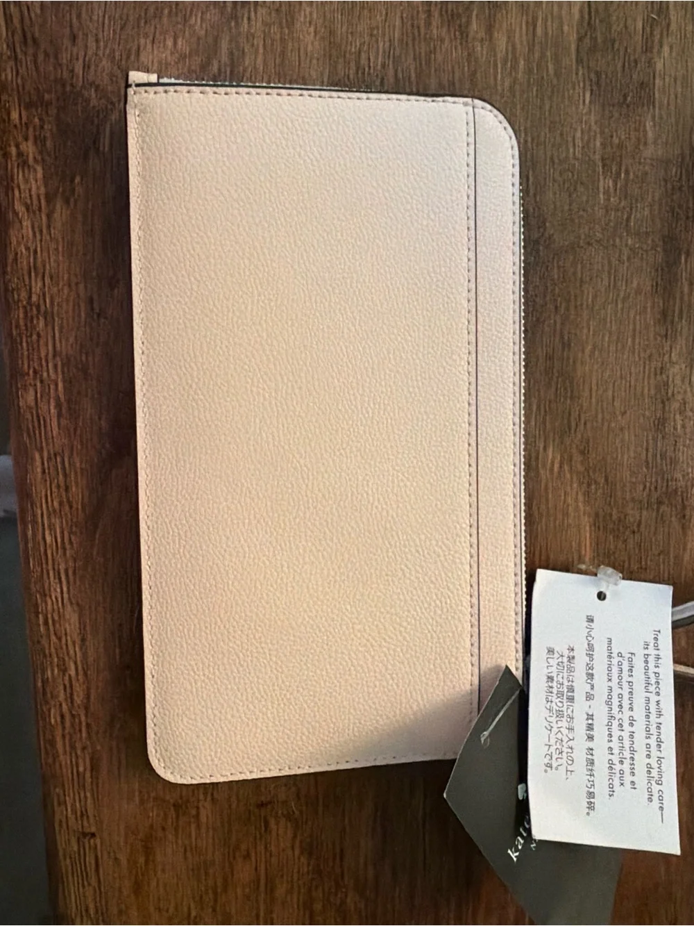kate spade pale pink zip-around wallet